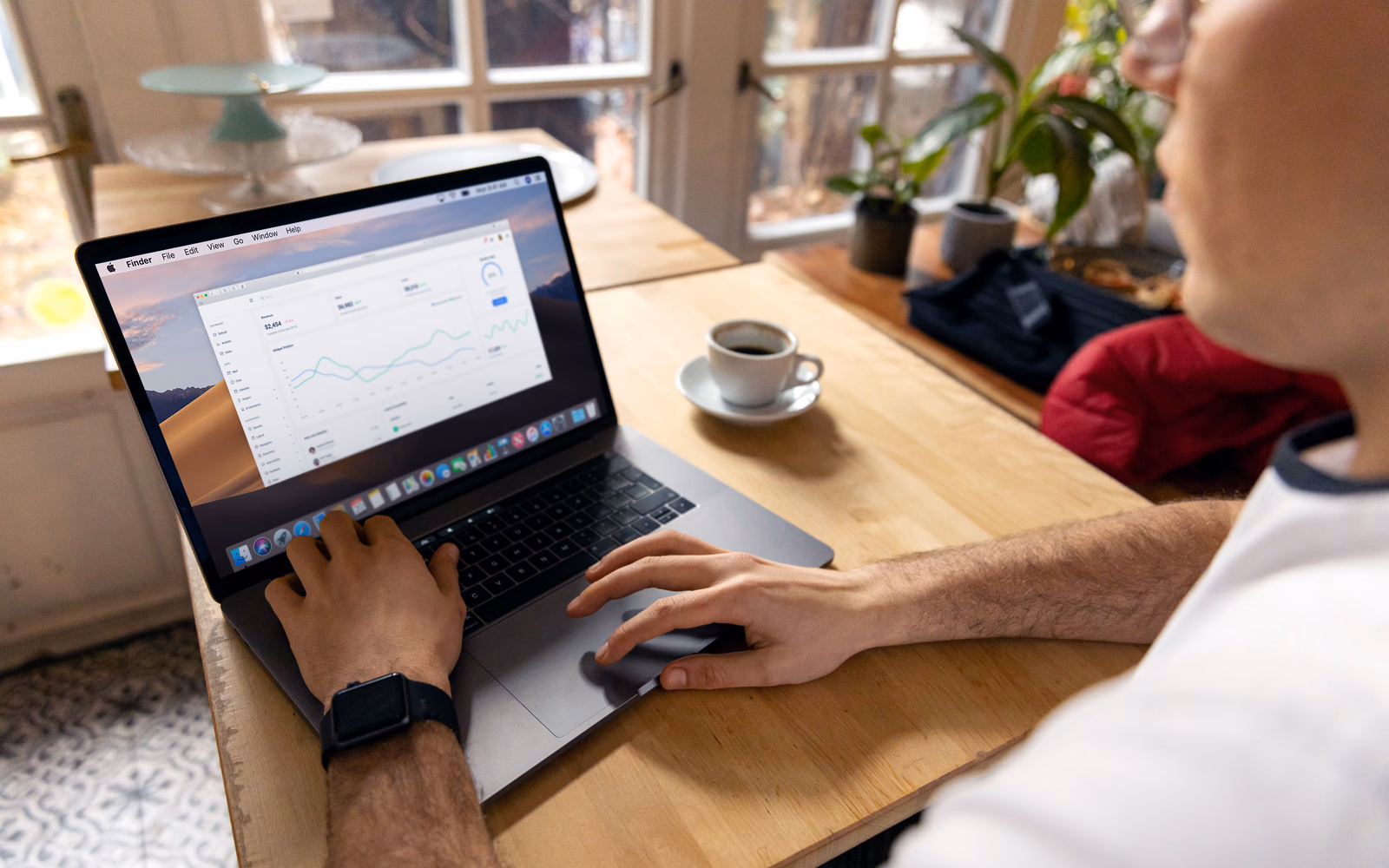 Business owner reviewing website conversion analytics on a laptop